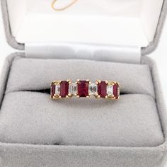 This beautiful band ring features five emerald-cut ruby gemstones of 1.56-carat weight with six natural earth-mined diamonds, all set in solid 14K gold. This band ring is made with solid 14K Gold and natural Earth mined SI / G-H diamonds. As listed, this ring is ready to ship. If you're interested in purchasing this setting with a different center stone please message us! Ruby Band Ring, Designer Silver Jewellery, Ruby Bands, Jewelry Showcases, Ruby Gemstone, Red Ruby, Natural Earth, Diamond Band, Earring Findings