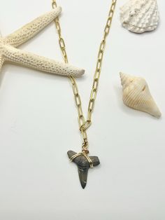 One of a kind unique shark tooth necklace. This listing is for 1 authentic fossilized shark tooth necklace that hangs from a gold paperclip chain. All teeth are found by me in the Gulf of Mexico 🦈 🌊  NECKLACE: * Chain Material: pleated linked chains * Sizing: 4 x 11 mm   * Necklace length: 18"  * Wire color: Gold PENDANT: * Authentic Fossilized Shark Tooth  * Each shark tooth is found by me in the Gulf of Mexico and they are unique to itself  * The listing is not for the tooth in the photo, bu Recycled Necklaces, Gold Spoon, Spoon Necklace, Shark Tooth Necklace, Beach Necklace, Fossil Jewelry, Tooth Necklace, Jewelry Beach, Beach Necklaces