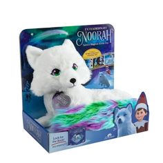 a white stuffed animal in a box with an elf on it's head and green eyes