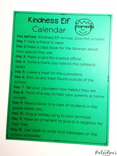 a green sign that says kindness elf calendar with instructions on the front and back side