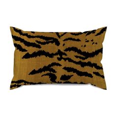 an animal print pillow with black and gold stripes on the front, sitting on a white background