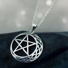 Dive into the celestial enchantment with our handcrafted Celtic Moon & Star Pendant, expertly crafted from the finest 925 Solid Sterling Silver! This exquisite piece is more than just jewelry; it's a miniature masterpiece that captures the mystique of the night. Each pendant, stamped with 925, measures approximately .91 x .91 inches, embodying the perfect blend of ancient symbolism and modern artistry. Complete your look with the optional 18" sterling silver cable link chain, and wear the night sky's allure close to your heart! Satisfaction Guaranteed! Symbolic Silver Star Necklace, Mystical Silver Star Jewelry, Mystical Silver Star-shaped Jewelry, Symbolic Star-shaped Engraved Necklaces, Sterling Silver Celestial Pendant Charm Necklace, Mystical Sterling Silver Necklace, Mystical Sterling Silver Round Necklace, Mystical Round Sterling Silver Necklace, Mystical Sterling Silver Necklace In Silver