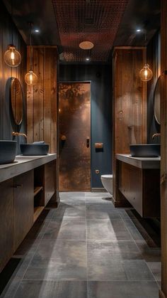 a large bathroom with two sinks and wooden cabinets on the walls, along with dark wood paneling