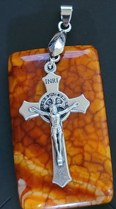 "This vintage exotic stone and silver crucifix pendant is definitely a statement piece. The Crucifix features St Benedict on the back.  Snakeskin agate is known for energizing the root, solar plexus and crown chakras, It can be an excellent tool in helping with emotional traumas. It promotes strength and perseverance during times of turmoil.   The St. Benedict medal when blessed offers exceptional protection from evil and is one of the 3 sacramental medals of the Catholic Church. The crucifix is Spiritual Crucifix Charm Necklace, Nickel-free Spiritual Jewelry And Charms For Jewelry Making, Nickel-free Spiritual Jewelry And Charms For Gifts, Nickel Free Spiritual Jewelry And Charms For Gifts, Spiritual Crucifix Necklace For Gift, Spiritual Crucifix Necklace As Gift, Gift Crucifix Necklace With Large Pendant, Large Crucifix Pendant Necklace As A Gift, Crucifix Necklace With Large Pendant As Gift