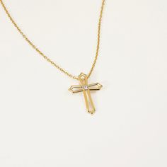 Diamond Open Cross Necklace Add a touch of elegance to your look with our Diamond Open Cross Necklace in 14K Gold. This beautifully crafted piece features a stunning diamond-studded cross pendant that hangs gracefully from a delicate gold chain. Perfect for any occasion, this necklace is a must-have for any jewelry collection. Shop now and experience the beauty of fine craftsmanship. You'll have: 14k solid gold handcrafted necklace 100% US sourced jewelry Size Material: 14k Solid Gold Diamond Ty Elegant Cross Pendant Necklace With Clavicle Chain, Elegant Pendant Cross Necklace With Clavicle Chain, Luxury Formal Cross Pendant Necklace, Luxury Crucifix Cross Necklace For Formal Occasions, Elegant Necklace With Clavicle Chain And Cross Pendant, Luxury Diamond White Cross Necklace, Elegant Pendant Cross Necklace With Adjustable Chain, Luxury Cross Necklace For Anniversary, Elegant Crucifix Necklaces With Adjustable Chain