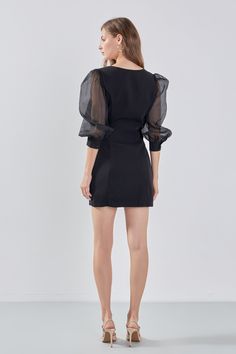 This Organza Blouson Mini Dress is the perfect addition to your wardrobe! Beautifully crafted from a mix of organza and other materials it features a boat neckline fitted bodice and mini length. Show off your legs and make a statement in this head-turning dress. It is sure to leave a lasting impression with its unique design and its exquisite materials will ensure you look stunning all night long. Make it yours today! Mixed media Mini length Boat neckline Fitted bodice Organza blouson sleeves Cu Party Mini Dress With Puff Sleeves And Structured Shoulders, Party Mini Dress With Structured Puff Shoulders, Elegant Sheer Mini Dress With Puff Sleeves, Elegant Dresses With Puff Mesh Sleeves, Evening Dress With Puff Mesh Sleeves, Elegant Organza Dress With Mesh Sleeves, Sheer Mini Length Formal Dresses, Formal Sheer Mini Length Dress, Elegant Organza Puff Sleeve Dress For Party