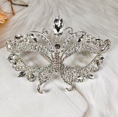 FAST & FREE SHIPPING DURABLE QUALITY: This Crystal Masquerade Mask is made of high-quality alloy and rhinestone diamond. They are manual workmanship, very comfortable to wear. ELEGANT DESIGN: The masquerade mask is encrusted shinny diamond rhinestone and crystal. The intricate and delicate are very glamorous, elegant and luxury. PRINCESS STYLE: You will be the center of attraction at party when you wear the princess style fancy mask. VARIOUS OCCASION: The masks are perfect for Masquerade party, Festivals, Carnival themed party, Formal balls, Halloween party, trick-or-treat, cosplay, Mardi Gras, theatrical plays, fashion shows, pageants, New Year's party, Prom, bridal showers and many other events and occasions. https://happyjewelryworld.etsy.com Butterfly Masquerade Mask, Butterfly Masquerade, Costume Masquerade, Masquerade Wedding, Carnival Themed Party, Happy Jewelry, Royal Crowns, Dazzling Earrings, Venetian Masquerade