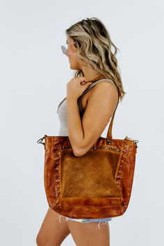 This is the leather bag you have dreamed about. The Bedstu Renata Bag in pecan is a favorite of ours at ECB. Such a rich and beautiful color that is perfect for the fall season. We can't wait to see how you style this gorgeous bag! Zipper ClosureRolled Leather HandlesHand Distressed Leather ExteriorInterior Zip Pocket12in.W x 12in.H x 3.5in.D12.5in. Handle Drop﻿Need help with sizing? No problem! Join our VIP group on Facebook, Everyday Chic Boutique VIP Insiders to chat directly with our team an Dark Tan Leather Bag For On-the-go, Fall Light Brown Tote Bag, Brown Hobo Bag With Braided Handles For On-the-go, Brown Satchel With Leather Handles, Luxury Brown Hobo Bag For Everyday, Chic Brown Bag With Leather Lining, Brown Bags With Braided Handles For Everyday, Brown Everyday Bags With Braided Handles, Brown Bags With Braided Handles For Fall