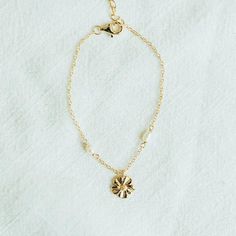 Get your summer fix with this gorgeous flower bracelet! Featuring a beautiful hibiscus design, it's the perfect accessory to add a sunny touch to your wardrobe. Summer won't know what hit it! -Flower Charm (9mm) -Freshwater Pearls -14K Gold-Plated -100% Sterling Silver Base -Nickel free -Hypoallergenic -Pearl Clasp -15cm Chain -3cm Extender -Tarnish Resistant Hibiscus Design, Pearl Clasp, Flower Bracelet, Flower Charm, Holiday Specials, Hibiscus, Freshwater Pearls, Gold Plate, Gems