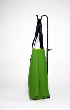 A fresh and modern style Neoprene Tote Bag-Green is made from high quality Neoprene.The minimalist design of this soft and sturdy tote bag suits any outfit and makes it a perfect every day bag. Ideal for the gym, study, travel, work, as baby bag or as an every day bag. Raw edges and no lining makes this style super light and easy to fold when traveling. Details:Color: greenMaterial: Soft neoprene Fits a laptop (up to 15 inch)inside zipped loose pocket to store your valuablesLeather shoulder stra Functional Green Shoulder Bag For Daily Use, Practical Rectangular Shoulder Bag For Shopping, Functional Green Tote Bag, Green Backpack For Shopping, Green Shopping Backpack, Green Square Bucket Bag For Everyday Use, Practical Tote Shoulder Bag For Shopping, Green Square Bucket Bag For Everyday, Square Green Bucket Bag For Everyday