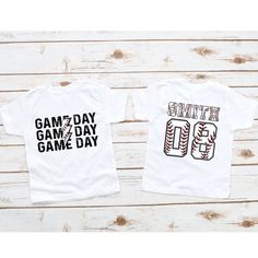 Custom Baseball Kids Shirt,Baseball Numbers Shirt,Baseball Team Shirt,Baseball Birthday Shirt,Baseball Mom Shirt,Boy Baseball Game Day Shirt Custom Baseball Mom Shirt, Mom Baseball Tee, Baseball Top for Mom Dad Nana, Baseball Day Season Shirt, Sports Mom Tee, Baseball Game Shirt Custom Baseball Mom Shirt, Mom Baseball Tee, Baseball Game Day Mam Nana Dad, Baseball Day Season Shirt, Sports Mom Tee, Baseball Game Shirt Beautiful artwork for all baseball lover   This tee is the cutest gift for baseball mom, baseball dad, baseball nana, baseball sister and a great gift idea for  baseball Game Day, baseball Season, Birthday gifts, family photos and pictures. 👉HOW TO ORDER👈 1️⃣ Please review all the information provided before placing an order 2️⃣ Select the shirt type and size using the drop d Game Day Team-colored T-shirt With Lettering, Team-colored T-shirt With Lettering For Game Day, Name Print T-shirt For Baseball Season, White Varsity T-shirt For Team Events, White Baseball Season Shirt With Team Name, Varsity T-shirt For Baseball Season Team Events, White T-shirt For Baseball Season Team Events, White T-shirt For Baseball Team Events, White Number Print Sports T-shirt