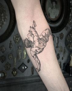 a person with a tattoo on their arm is doing a handstand dance pose