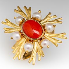 This incredible Denoir Brazil coral ring is crafted of 18k yellow gold and features an articulated design with coral, pearls, and textured gold. The ring is currently a size 10 and we offer complimentary resizing to fit. Coral Rings, Antique Cocktail Ring, Designer Rings, Sparkly Jewelry, Coral Ring, Ring Ideas, Fabulous Jewelry, Vintage Brooch, June Birth Stone