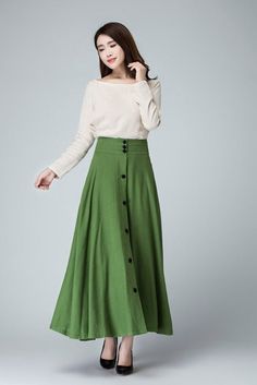 "This chic light green maxi skirt created with a soft linen, design with a fit and flare silhouette for a feminine feel , completed with a fitted waist for a defined figure. DETAIL * Soft linen * 50% linen , 50 cotton * No lining * Seam pocket * Right side zipper closure * Ankle Length * A Line skirt, button front skirt * Wash by hand or machine with cold water * Perfect spring, summer, autumn SIZE GUIDE Size vary between Brand and Country Please get your body measurement with our Size Guide And Green A-line Maxi Skirt For Spring, Chic Green A-line Maxi Skirt, Spring Buttoned Maxi Skirt, Buttoned Maxi Skirt For Spring, Green Fitted A-line Maxi Skirt, Spring Maxi Skirt With Buttons, Elegant Buttoned Flared Maxi Skirt, Elegant Green Wide Leg Maxi Skirt, Elegant Flared Maxi Skirt With Buttons