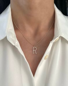 This dainty charm features the letter of your choice set in diamonds. 14K Yellow Gold Charm size and carat weight will vary based on letter Example R shown size is 16mm Bail size is 4.5 mm - fits over our diamond cut and petite ball chain only. R: 42 rounds diamonds 0.13 ct. 0.78 grams FINAL SALE Personalized Diamond Initial Necklace, Everyday Diamond Initial Necklace, Personalized Round Diamond Initial Necklace, Personalized Diamond Initial Necklace For Everyday, White Gold Initial Necklace With Diamond Accents, Elegant Rose Gold Diamond Initial Necklace, Round Diamond Initial Necklace, Diamond Initial Necklace In White Gold, Dainty Diamond Initial Necklace In White Gold