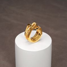 This 18K vermeil budding flower ring set abstractly depicts a flower burgeoning out of the sepal. The ring set consists of an outer frame and an insert, resembling the sepal and pedals respectively. Both the frame and the insert are of an open-end double band structure. The double band of the insert, with one side of the contour encrusted with clear pave cubic zirconia, is sectioned, rendering pedals yet to open. The 2 pieces can be worn individually or combined as a set. To ensure the long-last Fusion Style Yellow Gold Open Ring Jewelry, Modern Twist Yellow Gold Jewelry With Ring Detail, Contemporary Yellow Gold Rings As Gift, Contemporary Yellow Gold Open Ring Jewelry, Luxury Yellow Gold Rings With Unique Design, Modern Yellow Gold Ring With Unique Design, Contemporary 14k Yellow Gold Rings, Gold Diamond Fusion Rings, Gold Diamond Rings In Fusion Style