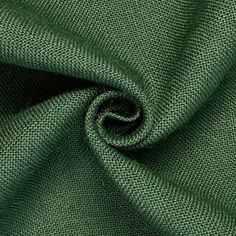 the green fabric is very close up and it looks like it has been woven in