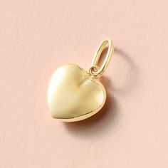 Made of real 14k gold (not plated, not filled, not vermeil), the Puffy Heart Pendant is available in your choice of yellow or white gold This pendant measures 17 x 9.8mm and is hollow inside (scroll down for additional dimensions and specifications) This item is final sale. Metal: 14K Gold Pendant Length (including bail): 17mm (0.67 inches) Pendant Width: 9.8mm (0.39 inches) Chain Passage Dimensions: 4 x 2.5mm Solid/Hollow: Hollow This item typically ships within 5-10 business days. However, due to increased order volume, please allow up to 3 weeks for item to ship.  For rush order requests and in-stock availability inquiries, please message shop directly prior to purchase. Gift box included. Please note that all sales are final and not eligible for return or exchange. Thus, please make su Yellow Gold Heart Charm Pendant, Heart-shaped Yellow Gold Charms For Anniversary, Yellow Gold Heart-shaped Charms For Anniversary, Yellow Gold Heart Charms For Anniversary, White Gold Heart Pendant Charms For Valentine's Day, Elegant Yellow Gold Heart Charm, Personalized Yellow Gold Charms For Valentine's Day, Valentine's Day Gift Charms In Yellow Gold, Valentine's Day Yellow Gold Charms