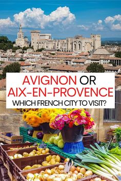 an outdoor market with lots of fresh produce and flowers on display in front of the city