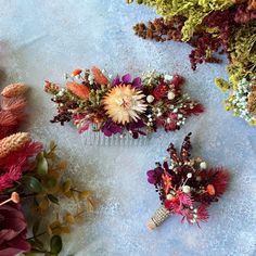 three hair combs with dried flowers on them