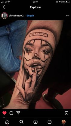 a person with a tattoo on their arm that has a woman's face in the middle