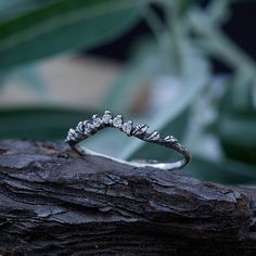 A simple little nesting band with leaves dancing across the front. The exquisite details of this natural design and its etched texture make this little ring the perfect addition to any ethereal engagement ring for a nature loving bride.  You can know that you're getting high quality hand-made crafted jewelry when you purchase items on TheFloraJewels. Handmade by an inspired jewelry artist team with decades of experience in the craft of jewelry making. This gorgeous ring is the perfect gift for t Silver Nature-inspired Stackable Rings For Anniversary, Nature-inspired Silver Stackable Rings For Anniversary, Pearl Engagement Ring, Couple Rings, Matching Rings, Oxidized Sterling Silver, Nature Design, Artistic Jewelry, Anniversary Rings