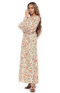 With voluminous long sleeves and an eye-catching empire waist, this maxi dress is an elegant piece you'll love to style. 56" length (size 2) Back zipper closure Jewel neck Long sleeves Lined 100% polyester Machine wash, line dry Imported Fall Midi Dress With Blouson Bishop Sleeves, Spring Floor-length Maxi Dress With Gathered Sleeves, Spring Maxi Dress With Gathered Bishop Sleeves, Modest Long Sleeve Floral Print Maxi Dress, Modest Long Sleeve Floral Maxi Dress, Spring Maxi Dress With Bishop Sleeves, Long Sleeve Dress With Gathered Sleeves For Brunch, White Dresses With Gathered Sleeves For Fall, Chic Spring Maxi Dress With Bishop Sleeves