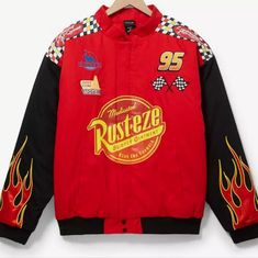 a red jacket with flames on it and the words rustezze written in yellow