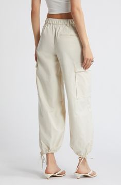 Drawstring ankle-length hems add versatility to these utilitarian cargo pants fashioned with recycled fibers. 28" inseam; 14" leg opening; 11 1/2" front rise; 13 1/2" back rise (size medium) Zip fly with button closure Front slant pockets; cargo flap-patch pockets Drawstring ankle hems 65% recycled polyester, 35% polyester Machine wash, tumble dry Imported Beige Cargo Pants With Pockets For Spring, Beige Spring Cargo Pants With Multiple Pockets, Beige Cargo Pants With Multiple Pockets For Spring, Spring Beige Cargo Pants With Multiple Pockets, Utility Cream Cargo Pants With Pockets, Utility Cream Cargo Pants, Cream Utility Cargo Pants, Cream Utility Cargo Pants With Pockets, Cream Utility Cargo Pants For Spring