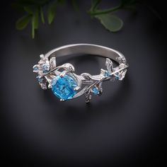 Discover the elegance of our 6mm Round Blue Topaz Ring, a perfect blend of unique design and superior craftsmanship. Featuring a stunning 0.75ct blue topaz set in a premium 3.80-gram band, this ring is available in three exquisite variations: Silver, 18K Gold, and Rose Gold. Whether for engagement, bridal bands, or special occasions, this ring adds a touch of luxury and sophistication to any look. The vibrant blue topaz, renowned for its captivating color and clarity, serves as the centerpiece o Ring For Women Silver, Silver Ring For Women, Rose Gold Bridal, Bridal Bands, Elegant Ring, Vintage Inspired Design, Vibrant Blue, Blue Topaz Ring, Classic Beauty