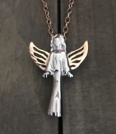 "Listing is for Angel with Rose Gold Colored Wings Urn Necklace, Necklace includes Angel Urn to hold a small amount of cremation ashes and your choice of silver or Rose colored 18 inch Stainless steel chain. Angel Urn is silver with rose gold colored wings 1 1/4\" x 1/2\" Stainless Steel ( ashes can be added at bottom when removing screw ) Necklace will come to you in a gift box :) Funnel, screwdriver and instructions to fill urn are included. Please be sure to follow instructions carefully for Rose Gold Sterling Silver Necklace, Sterling Silver Rose Gold Memorial Jewelry, Pet Cremation Jewelry, Pet Memorial Necklace, Ashes Necklace, Urn For Ashes, Urn Jewelry, Gold Angel, Urn Necklace