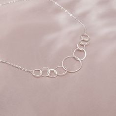 "This delicate 90th birthday necklace features nine lovely interlocking circles, hanging from the delicate 925 sterling silver chain. Each sterling silver necklace in this collection comes with a memorable quote printed on a wish card. It makes a beautiful and thoughtful 90th birthday gift for women. The message shown reads: Header: Happy 90th Birthday! Body: One Ring for One Fabulous Decade Here's to a happy 90 years, and cheers to 90 and more ✿Materials 925 Sterling Silver ✿ Product - Size Pen 90th Birthday Gifts For Grandma Grandmothers, Grandma 90th Birthday, Elegant Nickel-free Charm Necklaces For Birthday Gift, 90th Birthday Ideas, Multi-stone Sterling Silver Birthstone Necklace For Anniversary, 90th Birthday Pillow, Gold-colored Sterling Silver Birthstone Necklace For Birthday, 90 Birthday, Happy 90th Birthday