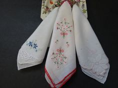 "Three white vintage ladies handkerchiefs with a floral design in one corner of each.  One white 11.5\" handkerchief is embroidered with a light pink flower, one with blue flowers which measured 10.5\", and one with a  white and deep pink flower bouquets that measures 11.5\". All is in good condition." White Handkerchiefs As Spring Gifts, White Handkerchiefs For Spring Gifts, Spring Gift White Handkerchiefs, Vintage White Handkerchief For Gifts, White Floral Embroidered Handkerchiefs For Gifts, Vintage White Handkerchiefs For Gift, Vintage White Handkerchief As Gift, Floral Embroidered Handkerchiefs For Spring Wedding, White Floral Embroidery Handkerchiefs For Gift