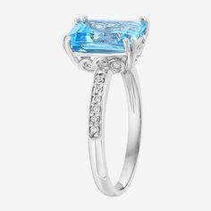 Ring Style: Cocktail RingsFeatures: Quick ShipDiamond Clarity: I1-I2Setting: ProngStone Cut: EmeraldDiamond Color: H-IMetal Color: WhiteRing Gallery Height: 6.5mmRounded Carat Weight: 1/10 Ct. T.w.Care: Wipe CleanStone Type: 1 Genuine Blue Topaz, 12 Natural DiamondAuthenticity: Genuine StoneBirthstone: December BirthstoneMetal: Sterling SilverCountry of Origin: Imported Classic White Gold Birthstone Ring With Blue Topaz, Classic White Gold Blue Topaz Birthstone Ring, White Gold Blue Topaz Baguette Cut Ring, Topaz Baguette Cut Ring With Prong Setting For Promise, Baguette Cut Topaz Promise Ring With Prong Setting, White Gold Emerald Cut Topaz Ring, Fine Jewelry Topaz Ring With Prong Set Baguette Cut, Fine Jewelry Baguette Cut Topaz Ring With Prong Setting, Emerald Cut Blue Topaz Ring In White Gold