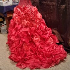 "Quinceanera or Sweet 16 formal evening gown. 2 piece skirt and corset top. Coral color, skirt is layers and layers of roses and ruffles. Skirt would circle low on top of hips, 30\" skirt waist. Top is vital beaded and beautiful. With corset back, it will fit a variable size. Dress is exquisive. A dress for a princess. Free shipping." Fitted Quinceanera Dress With Corset Back For Prom Season, Organza Quinceanera Dress With Ruffles For Debutante Ball, Organza Quinceanera Dress With Ruffles, Fitted Organza Quinceanera Dress For Prom Season, Fitted Organza Quinceanera Dress, Fitted Quinceanera Dress For Debutante Ball And Prom Season, Ruffled Organza Quinceanera Dress, Fitted Organza Quinceanera Dress For Party, Fitted Pink Quinceanera Dress For Party