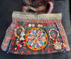 Beautiful boho bag handmade with vintage kantha cloth. Features beadwork and tassels from camel saddles and Indian Rupee coins.  18"w x 12"h  Sturdy shoulder straps  Zip top with two inside pockets Bohemian Beaded Tote Shoulder Bag, Bohemian Beaded Bags With Multicolor Embroidery, Bohemian Handwoven Shoulder Bag, Traditional Beaded Travel Bags, Bohemian Handwoven Shoulder Bag For Festivals, Traditional Beaded Shoulder Bag For Festivals, Bohemian Multicolor Shoulder Bag With Tassels, Beaded Bohemian Shoulder Bag For Festival, Artisan Handwoven Shoulder Bag For Festivals