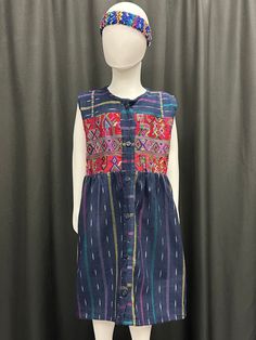 "This beautiful handmade dress reflects Guatemala's cultures through its vibrants colors and patterns. It has straps on the back for an adjustable fit. The dress has patchwork from different cities in Guatemala such as: Solola, Huhuetenango, Quiche and Sacatepequez. Size runs small. I would suggest to get one to two sizes bigger. Measurements: Armpit to armpit: 16\" Collar to bottom: 27\" Caring Instructions; - Wash separate with cold water - Air Dry or Lay Flat" Festive Multicolor Dresses With Woven Motifs, Festive Multicolor Dress With Woven Motifs, Multicolor Woven Motifs Dresses For Festivals, Multicolor Dresses With Woven Motifs For Festivals, Folk Style Cotton Dress With Traditional Patterns, Cotton Dresses With Traditional Embroidered Patterns, Cotton Dresses With Multicolor Embroidery And Traditional Patterns, Fitted Multicolor Dress With Woven Motifs, Folk Style Festive Multicolor Dresses