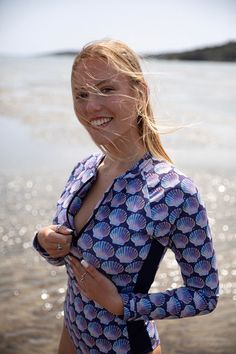 One-Piece Long-sleeve Swimsuit in purple and blue tones with a front zipper opening. You will fall in love with the diversity, texture, and pattern of this mesmerizing retro set; Seashells and stars 💜💙 High quality soft and durable Lycra 230gr with UV protection (Italian Lycra: Carvico.com) ☀️This piece includes a front side embroidery. Perfect as a swimwear, summer surfwear, and also for yoga and dancing. You can also wear it as a chic outfit styled with your favorite jeans and shorts. Tips: Chic Clothing Style, Sleeve Swimsuit, Surf Suit, Long Sleeve Swimsuit, Surf Wear, Chic Outfit, Black Women Fashion, One Piece For Women, Blue Tones