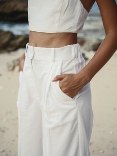 Designed to look and feel like a custom fit, the 100% Turkish cotton Pera Pants White have been crafted from comfy and breathable cotton. Boasting an unlined, wide-leg silhouette, binding on the front seams, the cotton Pera Pants are high-waist to flatter the figure and cut a dramatic shape. - 100% Turkish thick cotton - Hidden front closure - Side pockets - Zipper - Front seams with wide-leg cut silhouette - High-waist, elasticated back Summer Cotton Cargo Pants With Belt Loops, Chic Cotton Parachute Pants With Tapered Leg, Solid Cotton Wide-leg Pants, Fitted Wide Leg Cotton Cargo Pants, Solid Wide-leg Cotton Pants, Fitted Cotton Cargo Pants For Summer, Summer Cotton Wide Leg Work Pants, Cotton Straight Pants With Belt Loops, Summer Relaxed Fit Parachute Pants With Belt Loops