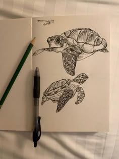 a drawing of two sea turtles in black and white, with a green pencil next to it