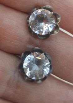 These Genuine Rock Crystal earings are a smaller size than the ones I hae hd before. The genuine rock crystals are 9mm and the buttercup setting is 13mm. The earrings are makred silver and were made in Japan. C. 1950. Follow me on instagram@jettesjewels. Vintage Silver Earrings With Prong Setting, Silver Faceted Crystal Earrings, Silver Faceted Round Crystal Earrings, Silver Gemstone Clip-on Earrings For Anniversary, Formal Silver Faceted Crystal Earrings, Vintage Silver Round Crystal Earrings, Silver Faceted Crystal Earrings For Anniversary, Silver Gemstone Clip-on Earrings, Silver Gemstone Round Clip-on Earrings