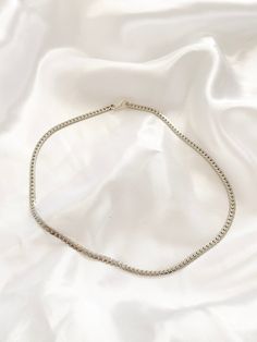 Simple Silver Flat Snake Chain. Great for layering up. Made of Non rust Stainless Steel Ensure to measure neck with measuring tape in inches. (You may want to leave a little extra room so your necklace is not too tight) Please select your length you would like you choker to be at checkout. Made from Stainless Steel, lead free, nicked free. Silver Choker Chain Necklace For Everyday, Everyday Silver Chain Choker Necklace, Everyday Silver Choker Chain Necklace, Curb Chain Choker Necklace For Gifts, Silver Snake Chain Choker, Silver Adjustable Curb Chain Necklace, Adjustable Silver Curb Chain Necklace, Everyday Silver Clavicle Chain Choker, Necklace Snake Chain