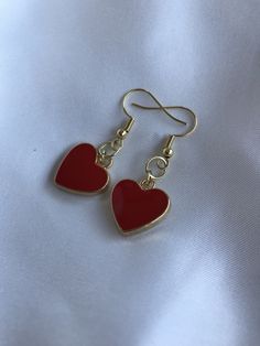 "FIRST TIME DISCOUNT: USE CODE FIRSTTIME20 FOR 20% YOUR FIRST ORDER! ♡ ALL PACKAGING IS 100% RECYCLABLE, BIODEGRADABLE, OR MADE FROM 100% RECYCLABLE MATERIALS ♡ These super cute gold heart dangling earrings are a perfect accessory to your already gorgeous ears! ALL ORDERS NOW COME WITH A GIFT BOX! Listing comes with two earrings (aka: one pair)! Dimensions: heart: 17mm entire earring: around 1.5\" (one and a half inches) long Materials: hook: 14kt Gold Plated 14kt Gold Filled ALL PACKAGING IS 10 Heart Shaped Earrings With Charm For Anniversary, Red Drop Earrings For Valentine's Day, Red Heart Pendant Earrings For Anniversary, Heart Detail Double Heart Earrings For Gift, Gift Double Heart Detail Earrings, Gold Heart Earrings With Heart Detail, Red Jewelry For Pierced Ears As A Gift, Hypoallergenic Drop Earrings For Valentine's Day, Heart-shaped Earrings With Heart Detail As Gift