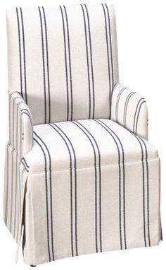 a white chair with black and white striped upholstered seat cover on the back