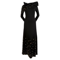 Exceptional, jet-black, wool jersey, maxi dress with gold toned studs and matching scarf designed by Givenchy dating to the 1970's. Dress fits a US 2 or 4. Measures approximately: 15" at shoulders, 32" at bust, 26" at waist, 36" at hips, 21.5" in arm length and 57" in overall length. Fully lined. Zips up center back. Made in France. Very good condition. Black Wool Dress, Givenchy Fashion, Jersey Maxi Dress, Vintage Things, Witchy Woman, Scarf Design, Wool Dress, Black Wool, Gold Studs