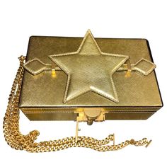 Oscar De La Renta Alibi Lam Leather Star Handle Box Clutch Worn By Beyonce On September 12, 2021 In Portofino ***Can Be Worn As A Clutch Or Shoulder Handbag On A Chain** Structured Minaudire With Utilitarian Hardware Removable Shoulder Chain Top Handle Top Flap With Clasp Closure Goldtone Hardware 1 Interior Compartment Interior Card Slot Leather Trim: Brass Made In Italy Size Height: 4.75" Width: 7.75" Depth: 2.25 This Is A Sample *****One Of One***** This One Has The Star On The Handle (Pictur Luxury Crossbody Box Bag For Party, Luxury Shoulder Bag With Box For Gift, Luxury Party Crossbody Box Bag, Top Handle Clutch With Original Box As Gift, Top Handle Clutch As Gift, Evening Crossbody Clutch With Original Box, Evening Clutch With Rectangular Case, Designer Gold Rectangular Case Bag, Designer Crossbody Clutch With Original Box