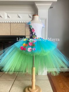 Welcome to Little Dreams by Mayra This dress is absolutely adorable and puffy! Just perfect for any birthday party, halloween, pageant or any occasion , your little one will look just adorable! Dress has three layers of tulle, Top has a handmade design in the front of the top only *If you need a different color just send me a message When selecting length you will select the longer layer in the back from armpit to floor, the front of the dress is shorter, if you wish to have the whole dress one length just let me a note at checkout  5'' crochet top will be used for sizes nb to 2T 8'' crochet top will be used for sizes 3T to 8years 10''crochet top will be used for sizes 9-10years 12''crochet top will be used for sizes 12years Shipping My orders are usually ready to ship in 7 business days, Princess Style Fairy Dress For Costume Party In Spring, Whimsical Summer Fairy Dress For Costume Party, Spring Princess Fairy Dress For Birthdays, Spring Princess Fairy Dress For Birthday, Princess Style Fairy Dress For Summer Costume Party, Fitted Tulle Fairy Dress For Pageant, Playful Fairy Dress For Spring Party, Playful Spring Fairy Dress For Party, Spring Party Fairy Dress In Playful Style