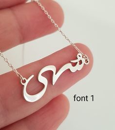 Gold Arabic Necklace With Heart, Gold Dainty Arabic Name Necklace, Custom Silver Arabic Gift, Two Heart Name Necklace, Arabic Lover Gift necklace is always written in 1 font. If you want Font 2, please write it in the personalization section.Custom Arabic Necklace, Dainty Arabic Name Necklace, Gold Arabic Gift, Arabic Calligraphy Name Necklace, Silver Name Necklace in Arabic The name is not included in the chain length. Example: 16 inch necklace: made as name + 16 inch chain Silver Signature Necklace For Wedding, Signature Silver Wedding Necklaces, Silver Pendant Name Necklace For Gifting, Silver Pendant Name Necklace As Gift, Silver Pendant Name Necklace For Gifts, Traditional Silver Engraved Name Necklace, Traditional Engraved Silver Name Necklace, Silver Name Necklace For Mother's Day, Traditional Name Necklace For Gift