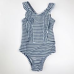 Beautiful Gap Baby Navy & White Swimsuit Gorgeous Ruffle Detail Two Sizes: 18-24 Months Toddler, 2 Yrs Toddler 18-24 Months 31-33 In 27-30 Lbs 2 Yrs Toddler 33-36 In 30-33 Lbs Shell: 82% Polyester, 18% Elastane/Spandex Lining: 100% Polyester U/V Protection 40+ Machine Washable White Ruffled Swimwear For Play, White Summer One-piece With Ruffles, White Summer One Piece With Ruffles, White Ruffled One-piece For Summer, White Ruffled One-piece Swimsuit, White Ruffled Summer One-piece, White Ruffled Summer One Piece, Striped Ruffle Swimwear, Summer Ruffled Bodysuit For Playwear