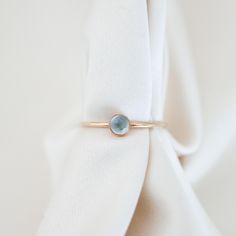 Everyone's favorite, aquamarine, shines in this ring. Its pale blue looks incredible in both silver and gold Details Band is 1 mm thick, stone is 4mm Gold fill or sterling silver Whole + Half sizes: US 3-14 (message us for smaller or larger sizes) See this page for ring sizing + conversions PS, check out our BFF, Soule Candles' aquamarine candles! Minimalist Aquamarine Gemstone Rings, Turquoise Aquamarine Birthstone Ring, Blue Minimalist Aquamarine Jewelry, Aquamarine Birthstone Promise Ring, Minimalist Topaz Birthstone Ring As Gift, Aquamarine Birthstone Ring In Fine Jewelry Style, Round Aquamarine Promise Jewelry, Aquamarine Birthstone Crystal Ring In Fine Jewelry Style, Blue Aquamarine Jewelry For Promise